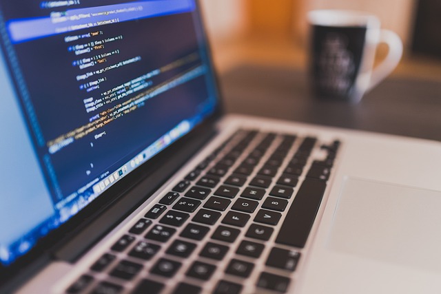 laptop with code editor on-screen